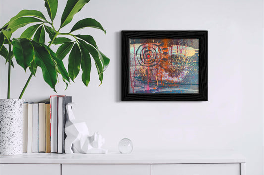 Funky, fun framed art above a credenza